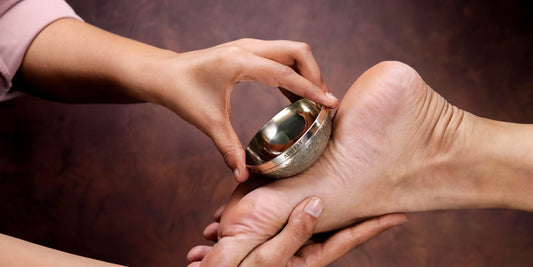 Massaging Foot with Kansya Vati