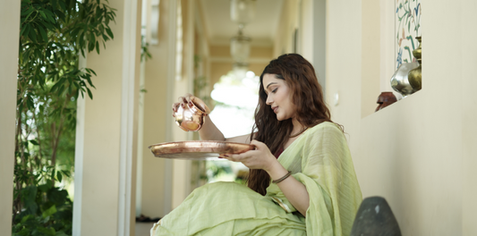 a women with copper vessel 