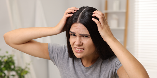 girl scratching head 